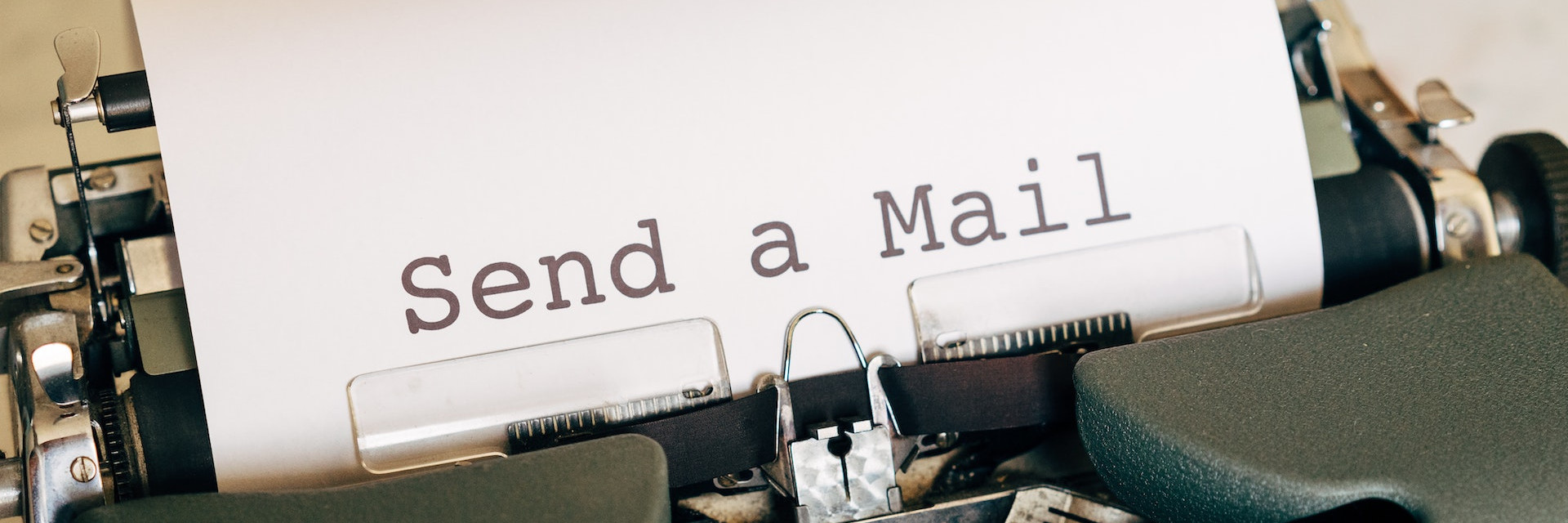 Old Olympus typewriter with paper: Send a Mail